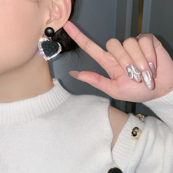 Gold Earrings with Black Heart-Shaped Pendant